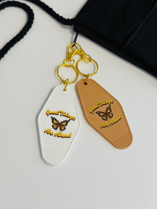 Good Things Are Ahead Motel Keychain with Butterfly Design